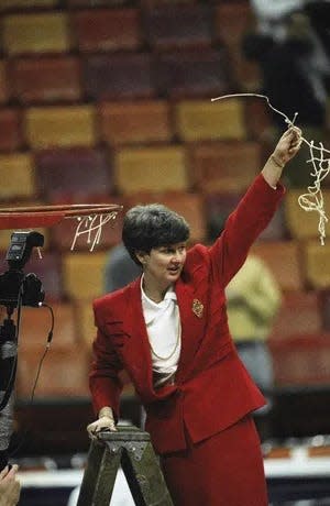 Texas Tech head coach Marsha Sharp swaves the cut net to the fans after Texas Tech defeated Ohio State 84-82 in the finals of the NCAA Division I Womens Basketball Championship on April 4, 1993, in Atlanta.