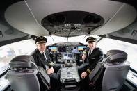 LOS ANGELES, CA - NOVEMBER 30: United Airlines Captain Stephen Kastner (L) and First officer Mike McCann sit in the cockpit of the new Boeing 787 Dreamliner at Los Angeles International Airport on November 30, 2012 in Los Angeles, California. In January the new jet is scheduled to begin flying daily non-stop between Los Angeles International airport and Japan's Narita International Airport and later to Shanghai staring in March. The new Boeing 787 Dreamliner will accomodate 219 travelers with 36 seats in United Business First, 70 seats in Economy Plus and 113 in Economy Class. The carbon-fiber composite material that makes up more than 50 percent of the 787 makes the plane more fuel-efficient. (Photo by Kevork Djansezian/Getty Images)