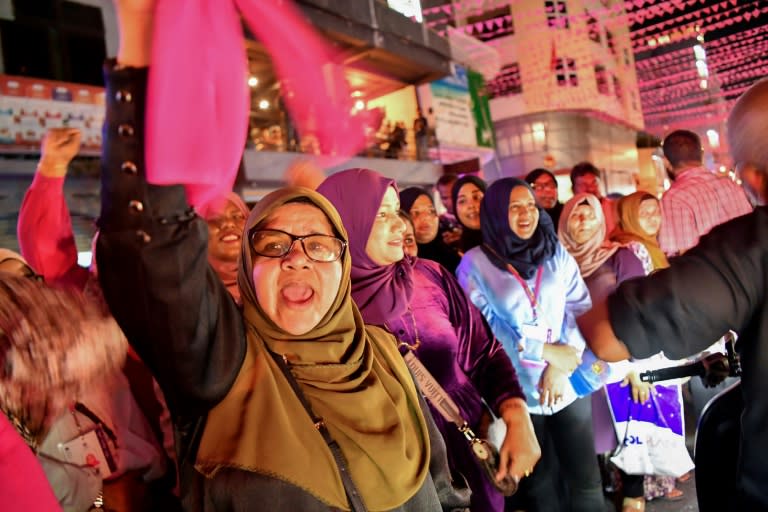 In the Maldives, supporters of the People's National Congress party and pro-China presidential frontrunner Mohamed Muizzu shout slogans in the capital Male after local media called the election for Muizzu, on September 30, 2023 (Mohamed Afrah)