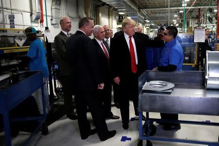 U.S. President-elect Donald Trump tours a Carrier factory with Greg Hayes, CEO of United Technologies (L) in Indianapolis, Indiana, U.S., December 1, 2016. REUTERS/Mike Segar