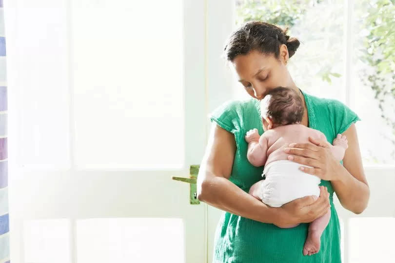 Mum holding baby