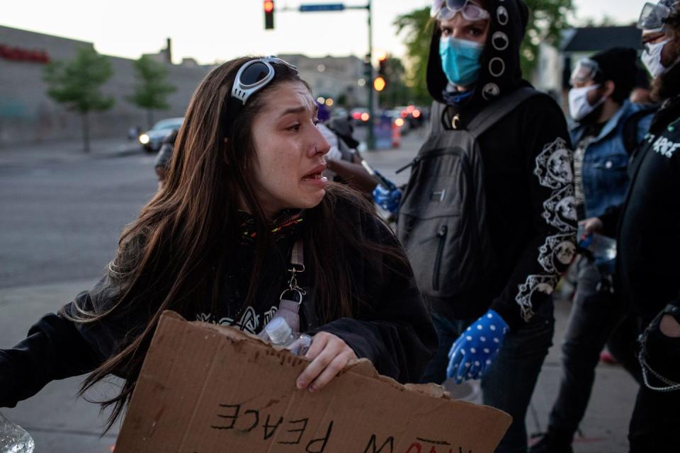 <p>Protesters retreat after police advanced using rubber bullets and teargas on Saturday, May 30th. Protesters gathered outside MPD’s Firth District building two days after demonstrators burned MPD’s Third Precinct building.</p>