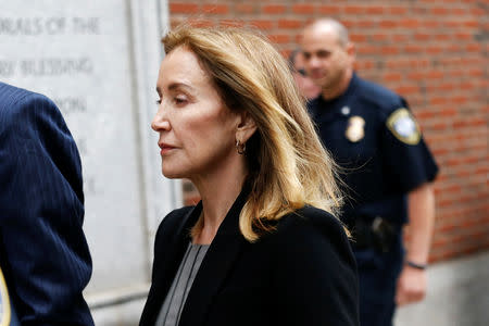Actor Felicity Huffman arrives at the federal courthouse to face charges in a nationwide college admissions cheating scheme in Boston, Massachusetts, U.S., May 13, 2019. REUTERS/Katherine Taylor