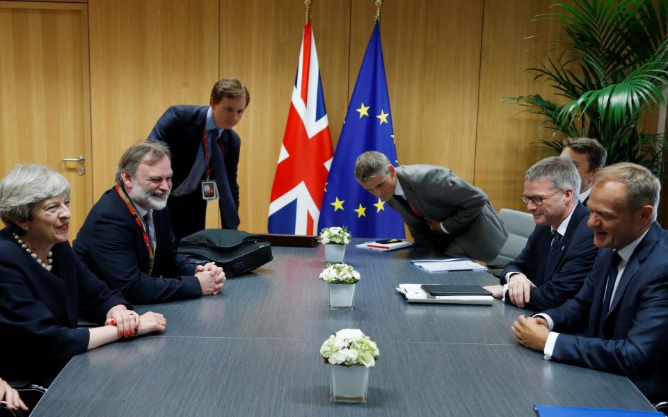 Theresa May at the negotiating table with European Council President Donald Tusk - Credit: AFP