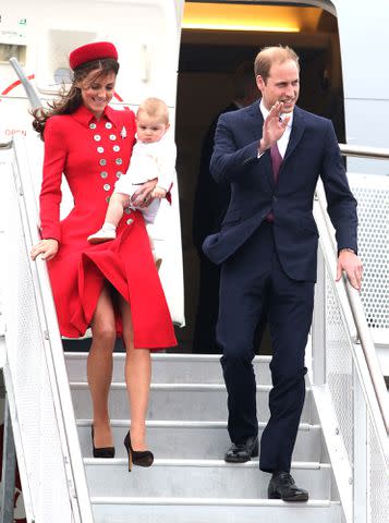 <p>Chris Jackson/Getty</p> Kate Middleton, Prince George and Prince William in Australia in 2014.