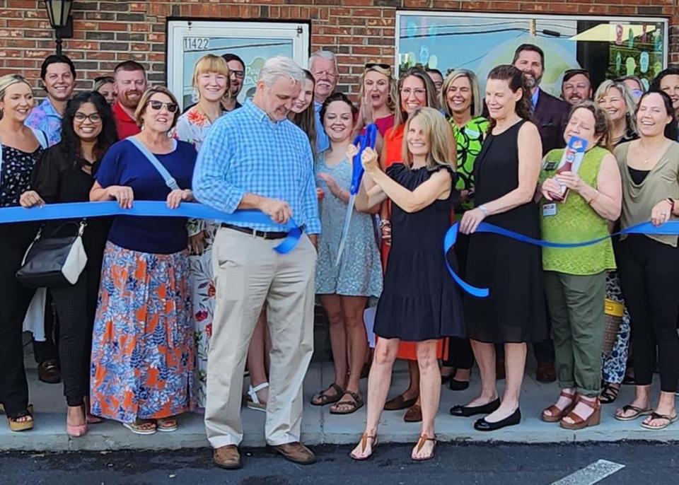 Owners Chris Hawk and Sonja Hawk cut the ribbon on their brand-new River Dog Bakery at 11422 Kingston Pike in August 2023.