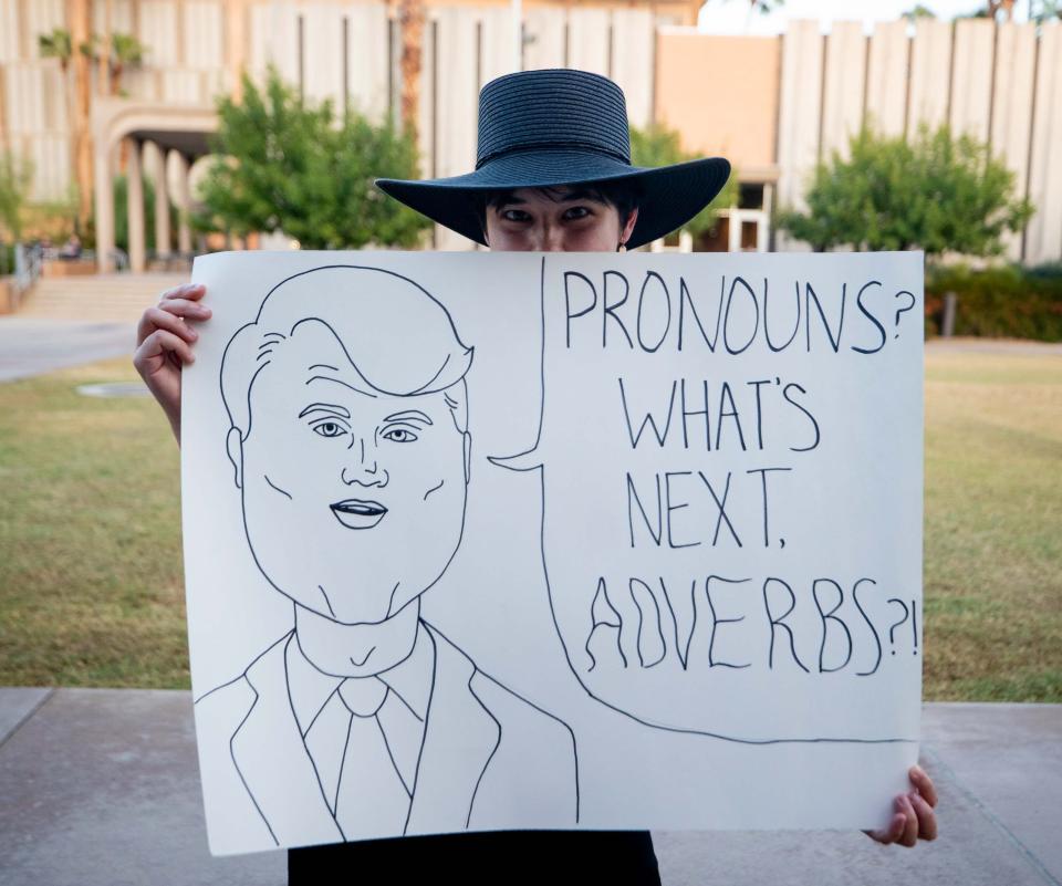 An Arizona State Sun Devil holds up a sign prior to a Turning Point USA event at the ASU Katzin Concert Hall in Tempe on Sept. 27, 2023.