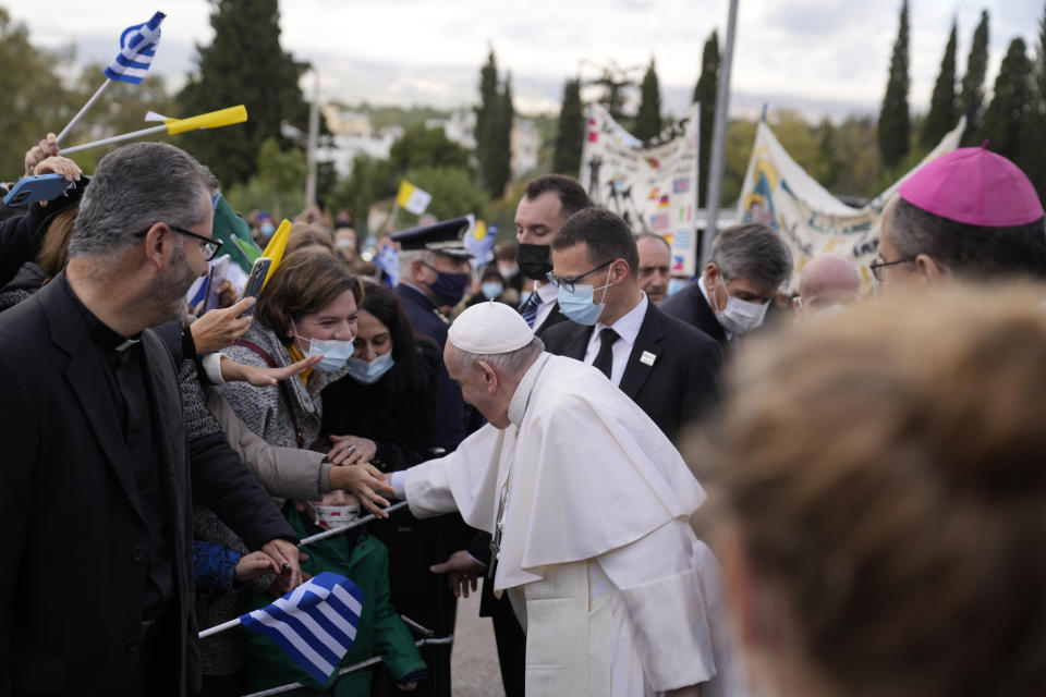 Pope Francis visits Saint Dionysius School of the Ursuline Sisters in Athens, Greece, Monday, Dec. 6, 2021. Francis' five-day trip to Cyprus and Greece has been dominated by the migrant issue and Francis' call for European countries to stop building walls, stoking fears and shutting out "those in greater need who knock at our door." (AP Photo/Thanassis Stavrakis, Pool)