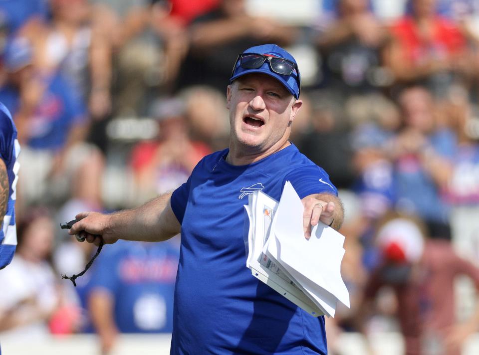 Bills special teams coach Matthew Smiley gets his players organized to run a play during practice. (USAT)