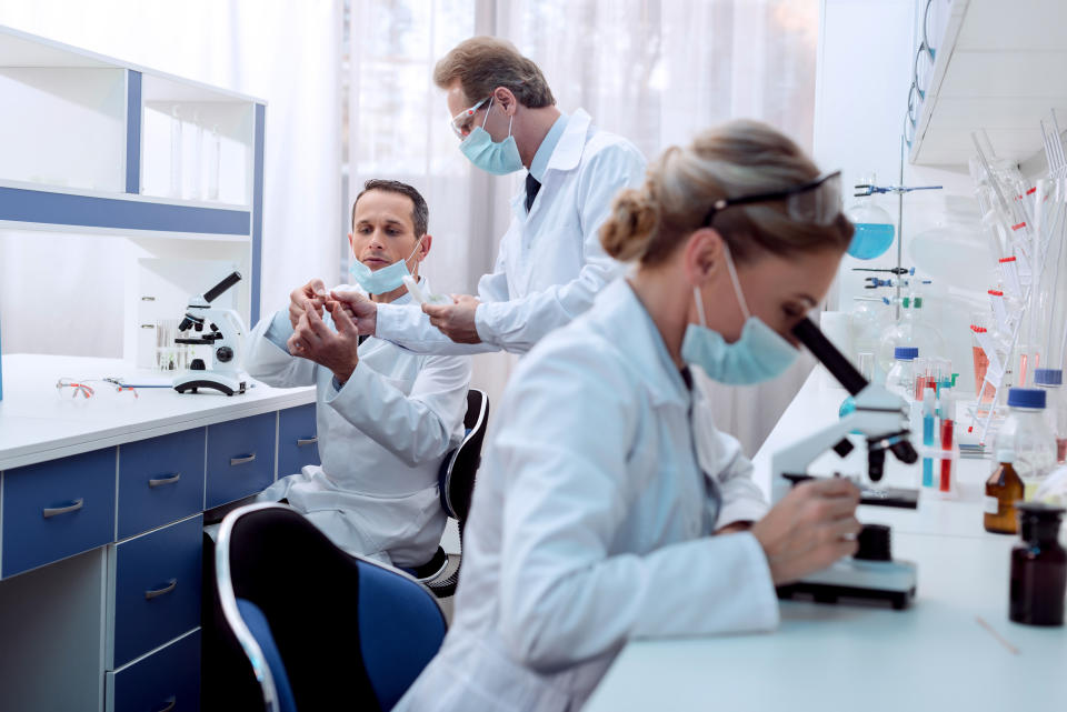 Three scientists in a lab