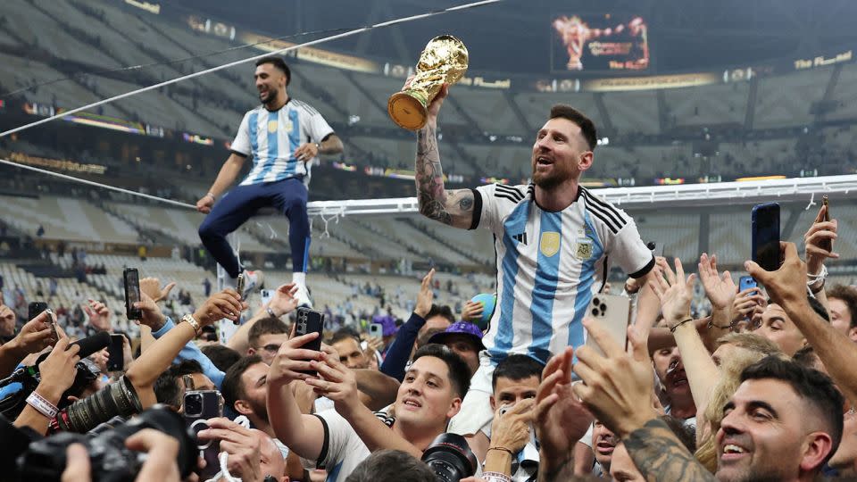 Messi celebrates winning the World Cup with Argentina in 2022. - Carl Recine/Reuters