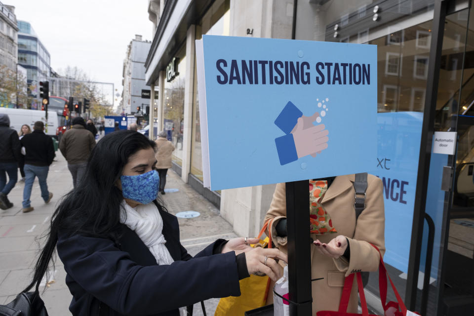 As the national lockdown ends and the new three tier system of local coronavirus restrictions begins, shoppers head out to Oxford Street to catch up on shopping as non-essential shops are allowed to reopen on 2nd December 2020 in London, United Kingdom. Many shoppers wear face masks outside on the street as a precaution as there are so many people around, as well as using hand sanitiser. (photo by Mike Kemp/In Pictures via Getty Images)