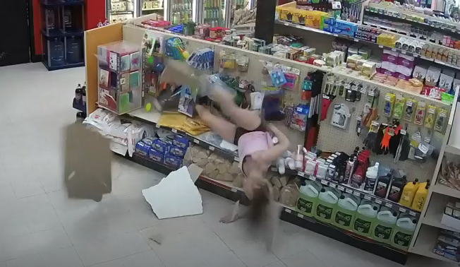 A 29-year-old woman crashes through the ceiling tiles of a convenience store while trying to evade police. (Photo: CBS)