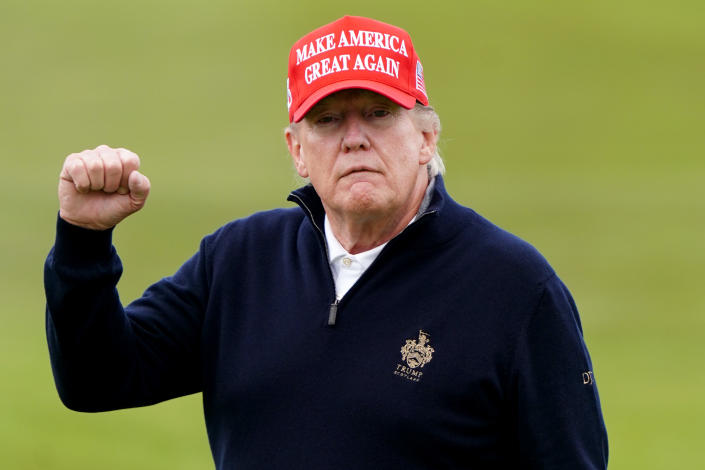 Former President Donald Trump with his first in the air at his Turnberry golf course.