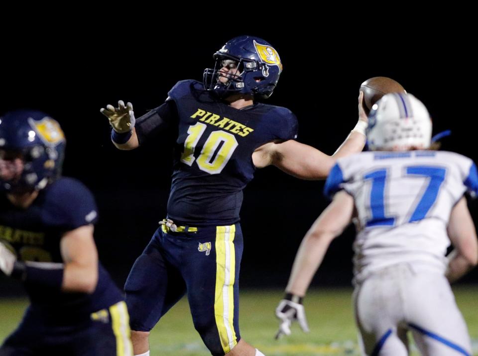 Pewamo-Westphalia quarterback Gabe Miller (10) throws a touchdown pass against Bath, Friday, Nov. 3, 2023, at Pewamo-Westphalia High School.