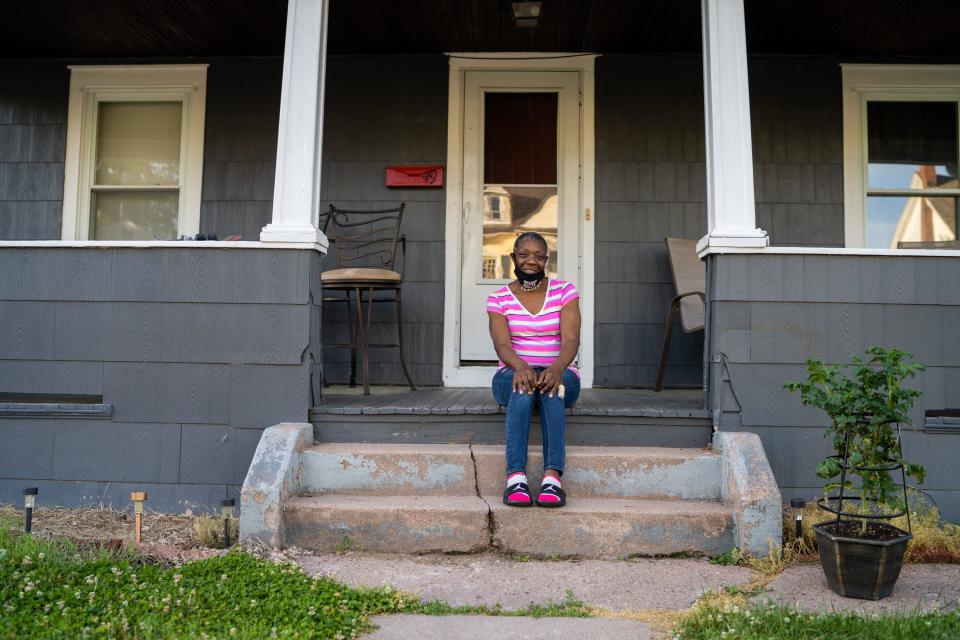 Carla Mitchell, 53, sits outside her Manchester, Conn., home on June 16, 2020. Mitchell receives treatment for bipolar disorder and PTSD at Community Health Resources.