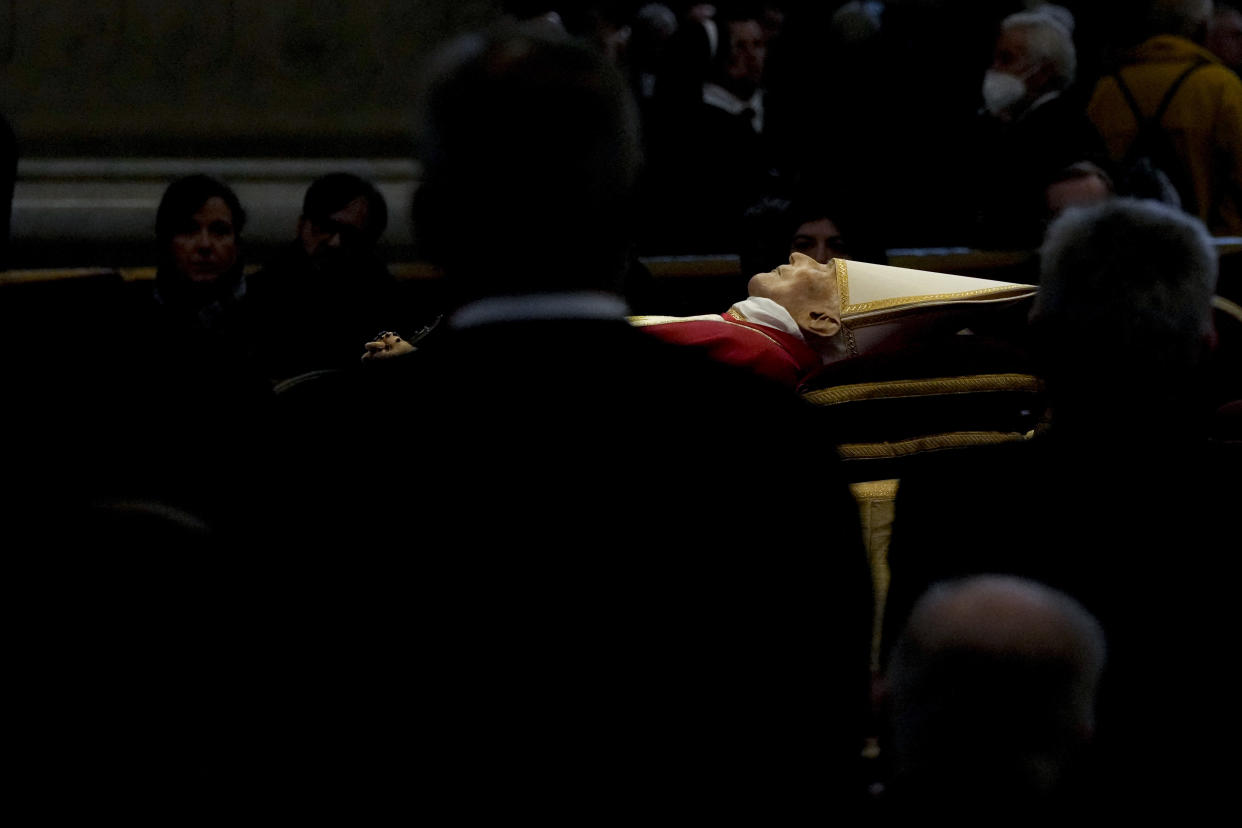 The body of late Pope Emeritus Benedict XVI is lied out in state inside St. Peter's Basilica at The Vatican, Wednesday, Jan. 4, 2023. Pope Benedict, the German theologian who will be remembered as the first pope in 600 years to resign, has died, the Vatican announced Saturday, Dec. 31, 2022. He was 95.(AP Photo/Ben Curtis)