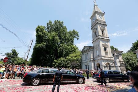 Jun 10, 2016; Louisville, KY, USA; The hearse carrying Muhammad Ali arrives at Cave Hill Cemetery. Mandatory Credit: Mark Zerof-USA TODAY Sports