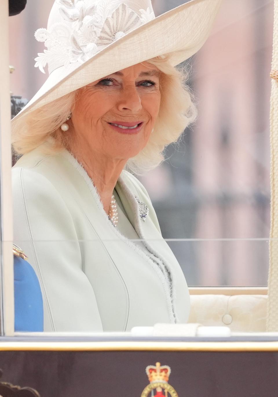 Queen Camilla smiles at royal fans who have lined The Mall (Jonathan Brady/PA Wire)