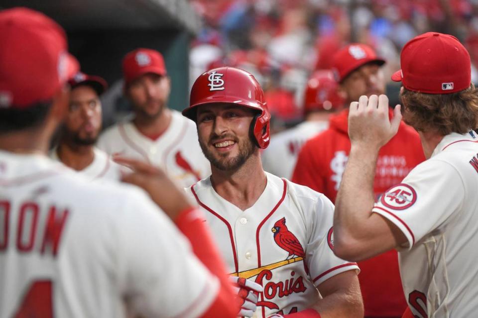 St. Louis Cardinals’ Paul DeJong is congratulated after hitting a home run during a game against the Cincinnati Reds last season in St. Louis. Roster complications for the 2023 season embroil DeJong, whose own numbers both tell and don’t tell the story of his spring.