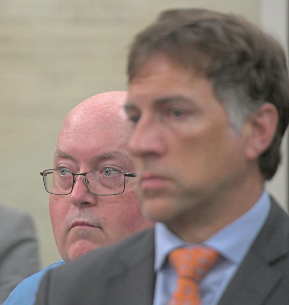 Mark Cooper stands with defense attorney James Mayer III during his retrial in front of Judge Brent Robinson. Cooper, 57, is accused of causing the death of a Richland County jail inmate in 2019.