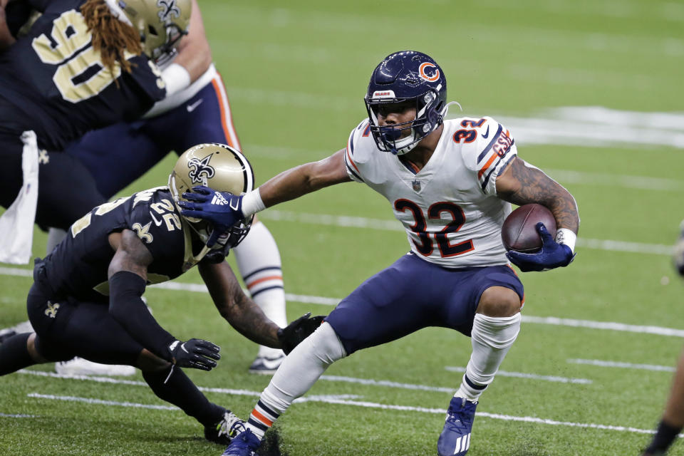 Chicago Bears running back David Montgomery (32) carries against New Orleans Saints free safety Chauncey Gardner-Johnson (22) in the first half of an NFL wild-card playoff football game in New Orleans, Sunday, Jan. 10, 2021. (AP Photo/Brett Duke)