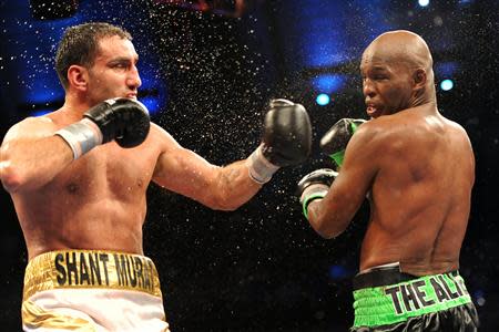 Oct 26, 2013; Atlantic City, NJ, USA; Bernard Hopkins (black/green trunks) and Karo Murat (white/gold trunks) box during their IBF Light Heavyweight title bout at Boardwalk Hall. Hopkins won via unanimous decision. Mandatory Credit: Joe Camporeale-USA TODAY Sports