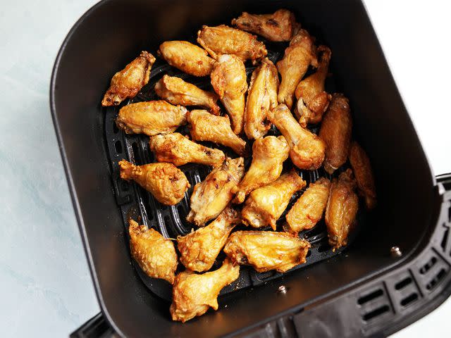 <p>Serious Eats / Riddley Gemperlein-Schirm</p> See these air-fried wings? Browned, but no where near deep-fried.