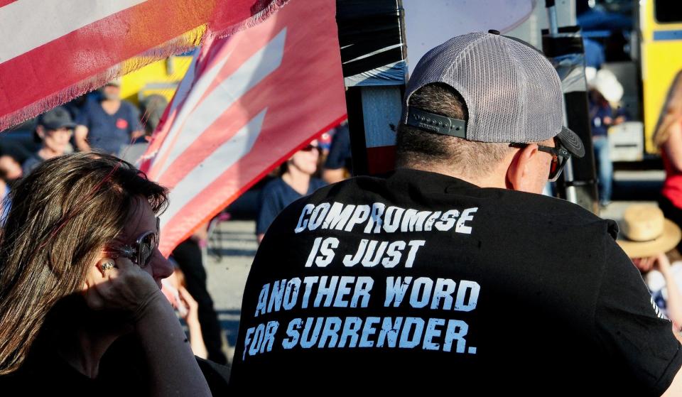 A message on a t-shirt helps set the tone for a rally at the return of The People's Convoy at the Hagerstown Speedway Wednesday evening.