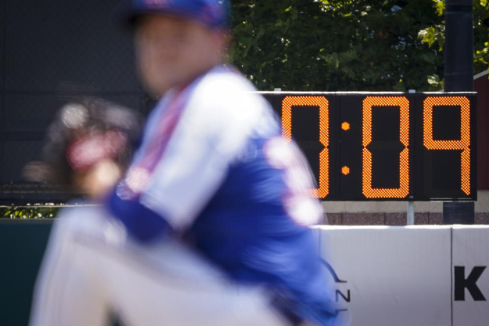 A pitch clock is deployed to restrict pitcher preparation times during a minor league baseball game between the Brooklyn Cyclones and Greensboro Grasshoppers, Wednesday, July 13, 2022, in the Coney Island neighborhood of the Brooklyn borough of New York. Major League Baseball is considering a pitch clock for next year along with shift limits, larger bases and restrictions on pickoff attempts. (AP Photo/John Minchillo)