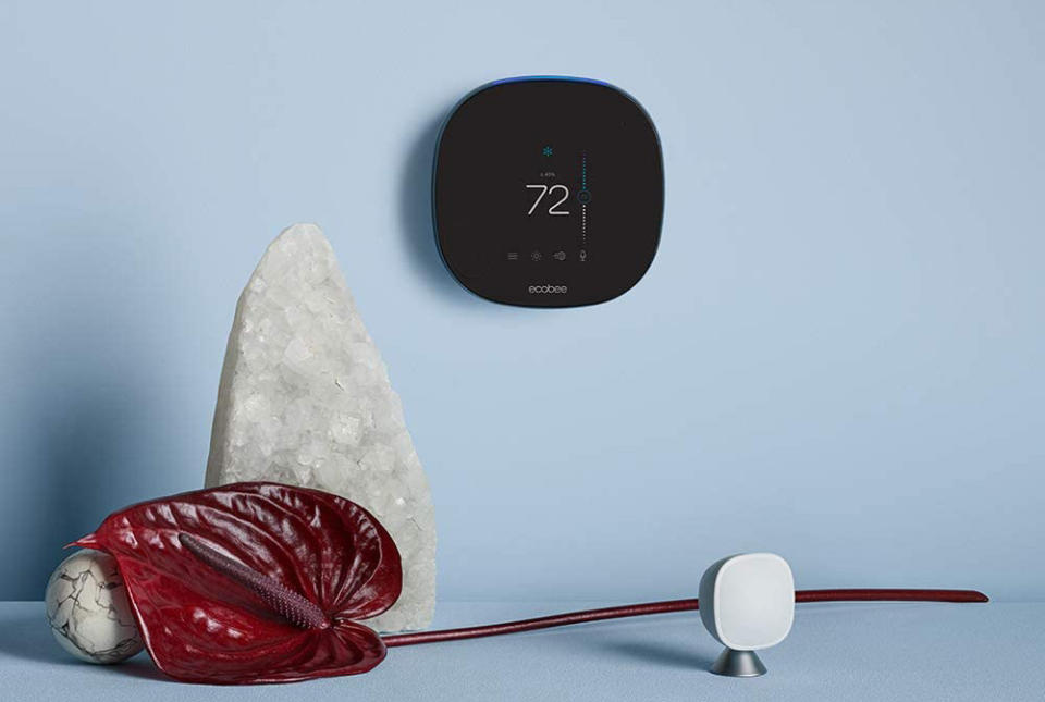 The Ecobee SmartThermostat next to an Ecobee remote temperature sensor