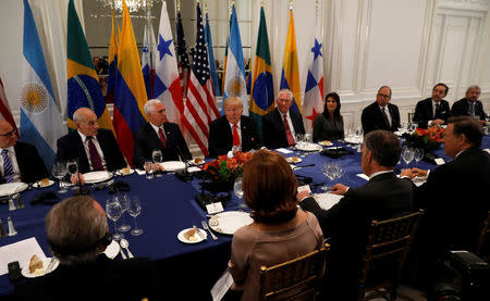 U.S. President Donald Trump (C) attends a working dinner with Latin American leaders in New York, U.S., September 18, 2017. REUTERS/Kevin Lamarque