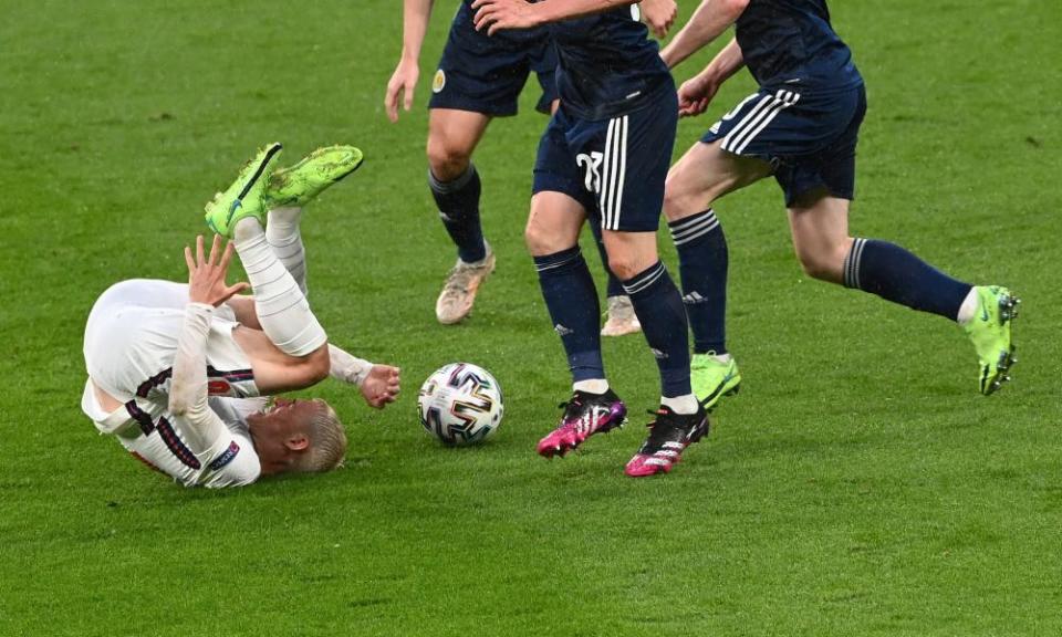 England’s Phil Foden takes a tumble