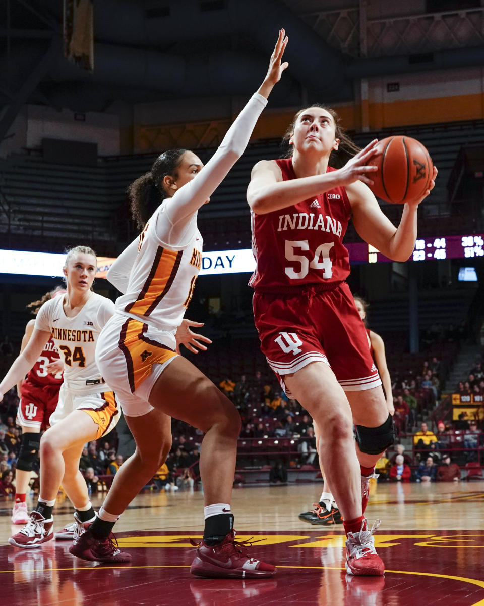 Indiana forward Mackenzie Holmes (54) looks to shoot over Minnesota guard Angelina Hammond during the second half of an NCAA college basketball game on Wednesday, Feb 1, 2023, in Minneapolis. Indiana won 77-54. (AP Photo/Craig Lassig)