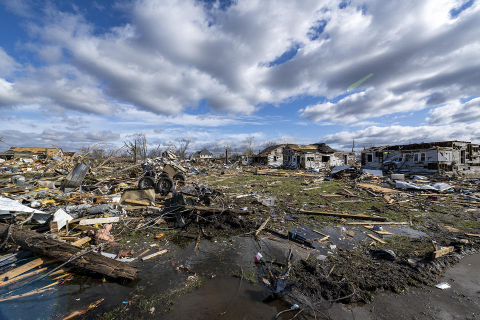 Damage from a late-night tornado is seen in Sullivan, Ind., Saturday, April 1, 2023. Multiple deaths were reported in the area following the storm. (AP Photo/Doug McSchooler)