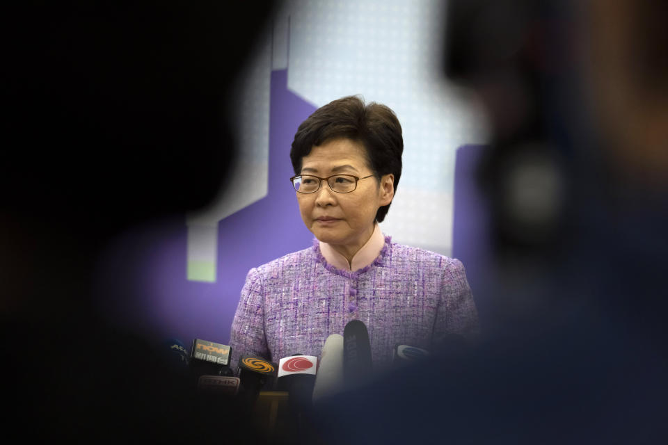 Hong Kong Chief Executive Carrie Lam listens to a reporter's question during a press conference in Beijing, Wednesday, Dec. 22, 2021. Hong Kong's leader Carrie Lam met with top leaders in Beijing on Wednesday to report to them on the territory's first legislative elections held under new laws ensuring that only "patriots" loyal to the ruling Chinese Communist Party could run as candidates. (AP Photo/Mark Schiefelbein)