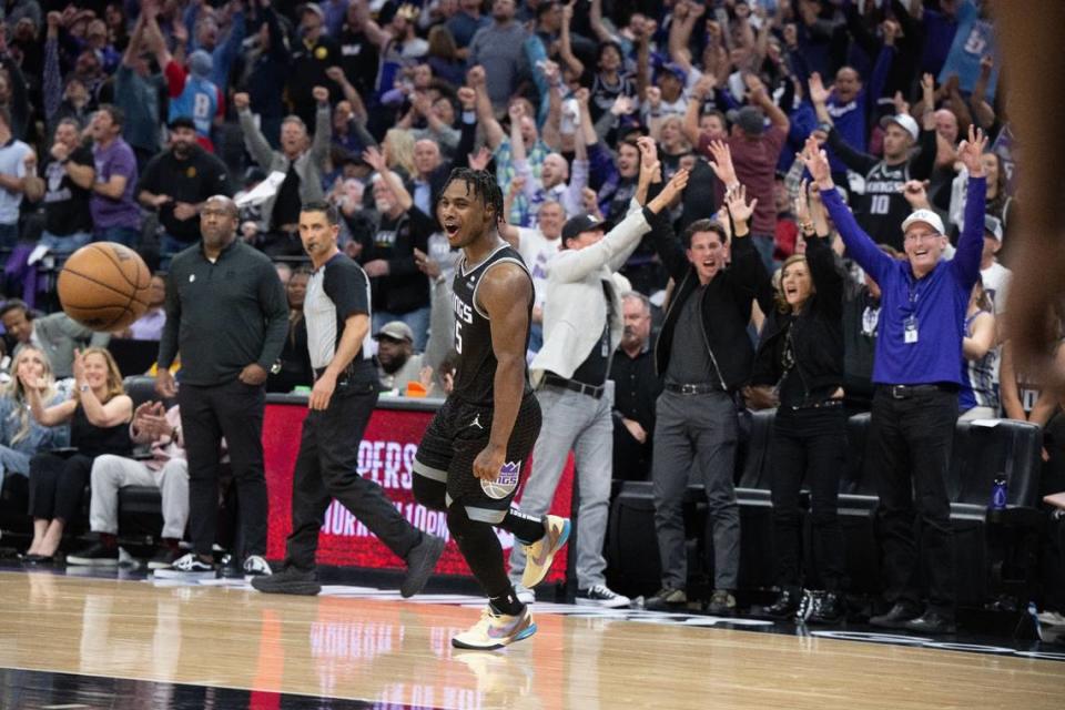 Sacramento Kings guard Davion Mitchell (15) celebrates a three point basket with the home crowd during Game 2 of the first-round NBA playoff series at Golden 1 Center on Monday, April 17, 2023.