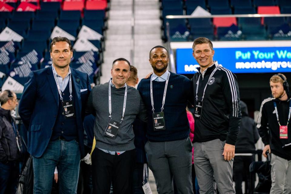 Key Charlotte FC executives pose for a photo before a Charlotte FC contest against St. Louis in March 2023. From left to right: Zoran Krneta (Charlotte FC sporting director), Joe LaBue (Charlotte FC president), Darrius Barnes (Crown Legacy FC presidnet), Bobby Belair (Charlotte FC technical director).