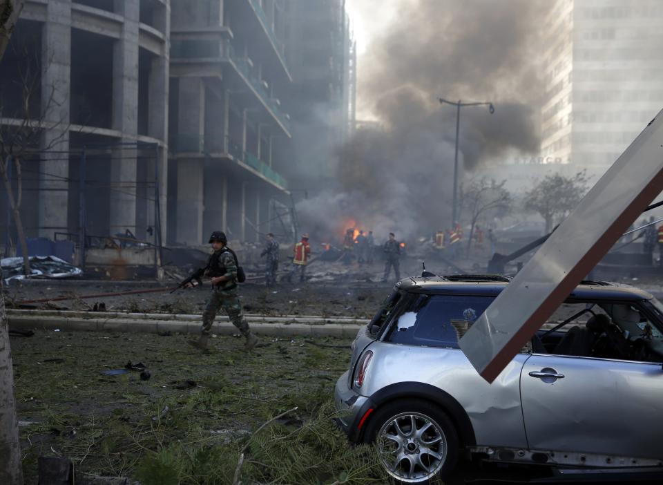 Fires burn and smoke rises from the site of explosion in Beirut downtown area