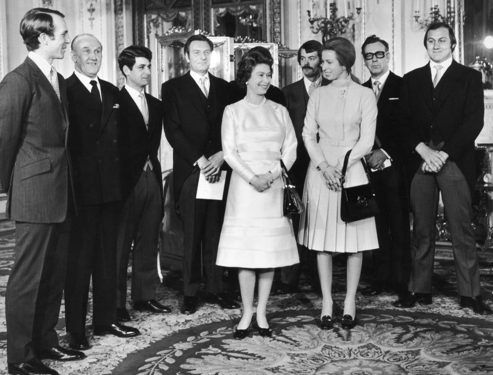 A photo of Princess Anne, Captain Mark Phillips and Queen Elizabeth with a group of guests including Inspector James Beaton, journalist Brian McConnell and Detective Constable Peter Edmonds who were all involved with foiling a kidnap attempt on the Princess, 26th November 1974.