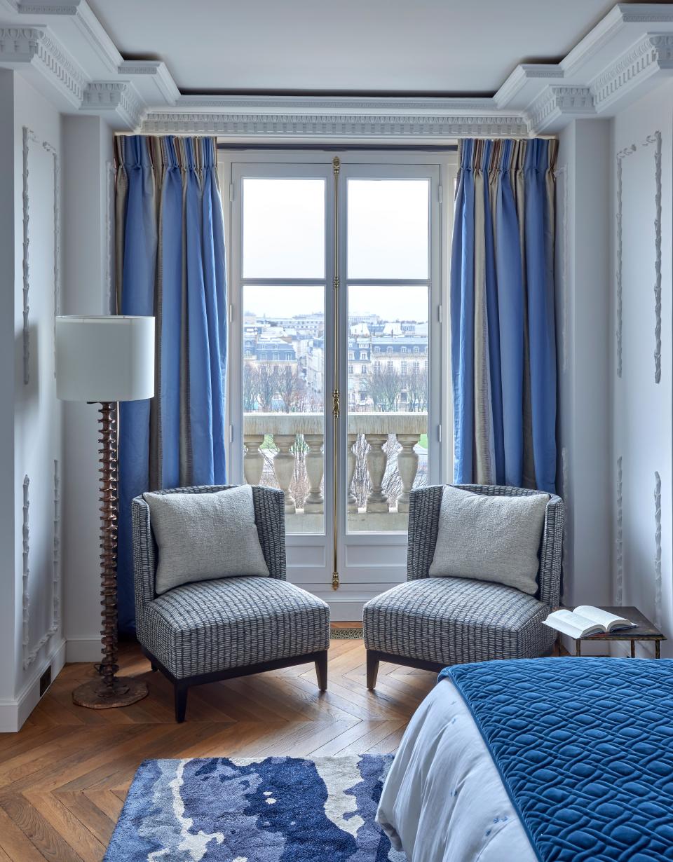 A reading corner in the main bedroom. Carpet is Holland & Sherry; chairs are by Nobilis Paris; fabrics are by Rubelli.