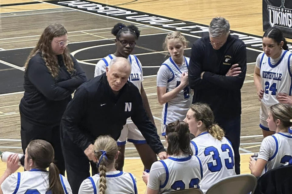 In this photo provided by Sam Zullo, Jim Zullo, left, coaches Northville High School girls at Hudson Valley Community College in Troy, N.Y. March 4, 2024. Jim Zullo will coach Northville in the New York state high school semifinals on Saturday, March 16, the same day his son, Sam Zullo, will coach Simsbury High School girls for the Connecticut state high school title. (Sam Zullo via AP)