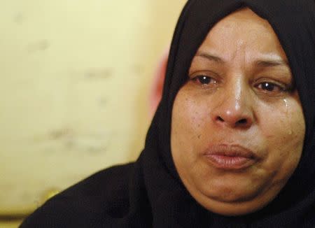 Afafa Abdel Magid, 49, mother of Samir, a 10-year-old Egyptian boy who died during clashes between supporters and opponents of deposed Islamist President Mohamed Mursi, cries during an interview with Reuters in their house in Suez May 25, 2014. REUTERS/Stringer