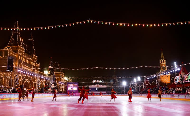 Skaters perform during the opening of an outdoor skating rink in the Red Square in Moscow