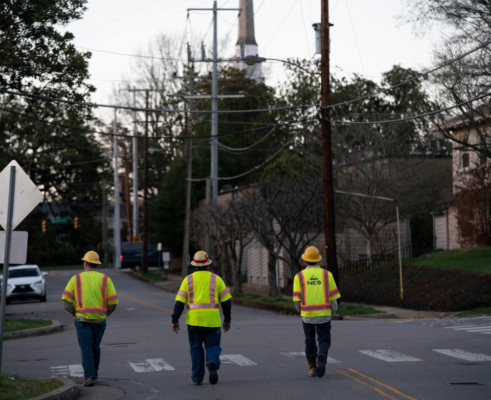 NES workers check power lines along Wilson Blvd. near West End Ave. after severe weather and strong winds blew through Nashville, Tenn. Friday, March 3, 2023.