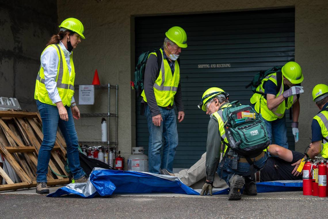 Members of Gig Harbor’s first graduating class for their community emergency response team completed their certification class on Saturday Aug. 13, 2022. They had to work together as a team in a simulation to save mock victims following an earthquake.