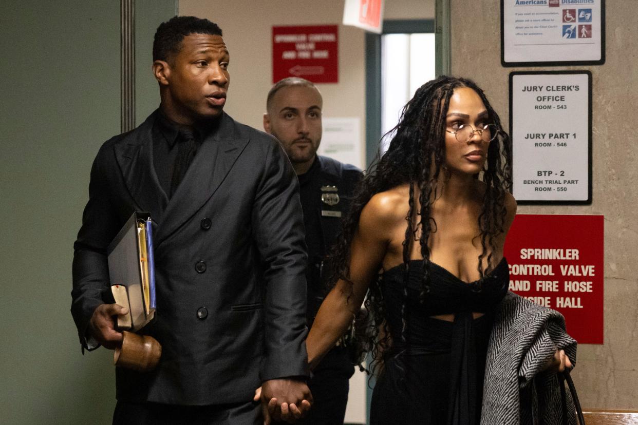 Jonathan Majors (pictured here Dec. 4, 2023) has been joined by girlfriend Meagan Good (right) during his court appearances.