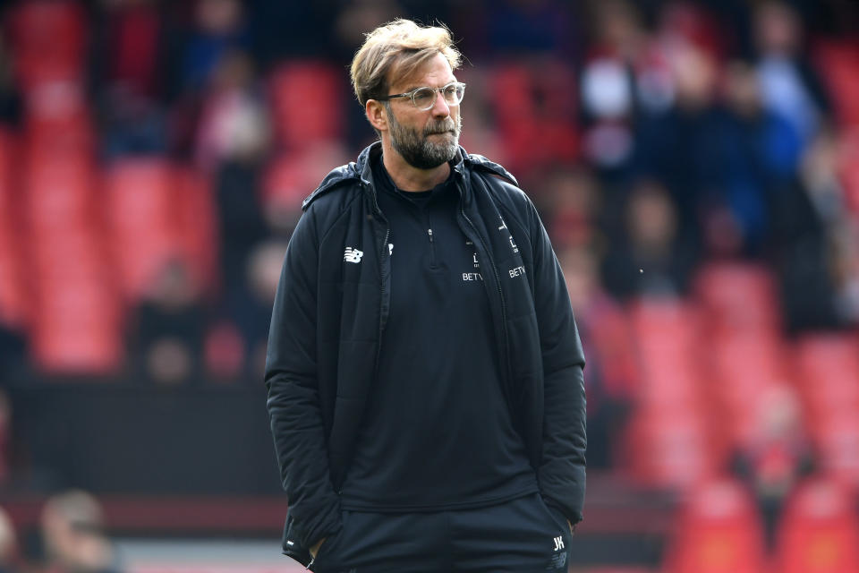 <p>Liverpool boss Jurgen Klopp watches his players warm up </p>