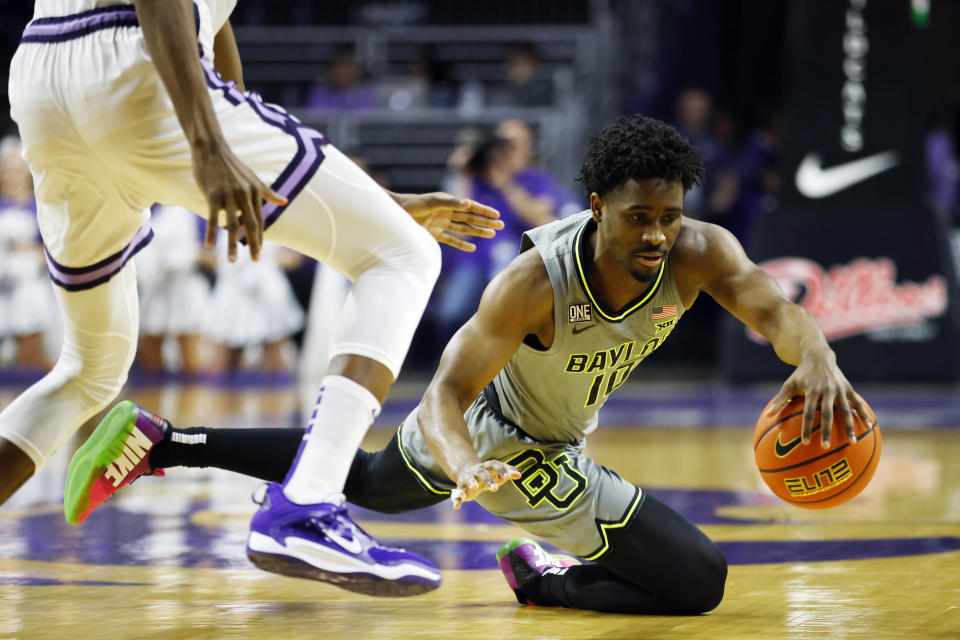 Baylor guard Adam Flagler goes after a loose ball during the first half of an NCAA college basketball game against Kansas State, Tuesday, Feb. 21, 2023, in Manhattan, Kan. (AP Photo/Colin E. Braley)
