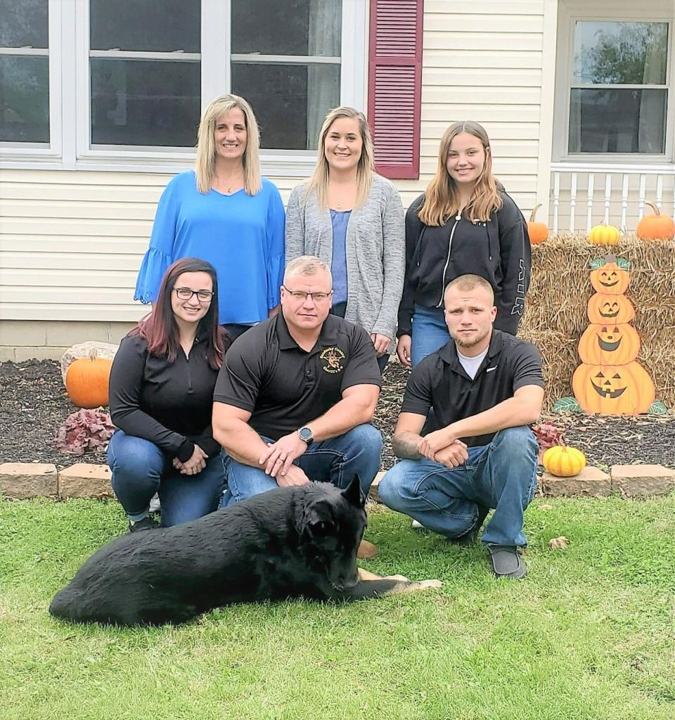 The Brian McGrady family had their photo taken with K-9 officer Brutus center front as he was a very important part of their family.